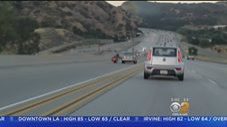 Biker Kicks Car, Driver Retaliates and Causes a Pile Up on the Freeway