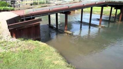 Water Displacement from Ship Causing Damage in Neighborhood Canal