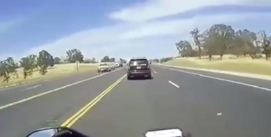 Motorcycle Rider Crashes Directly Into The Back of a Cop Car!