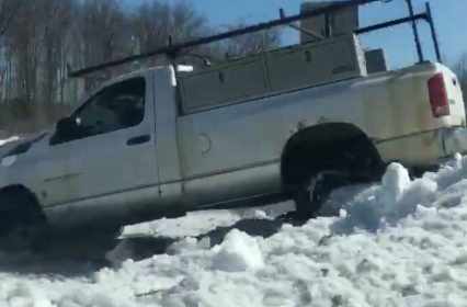 Crazed Man Barrels Down The Road Slamming His Truck Into Wall of Snow!