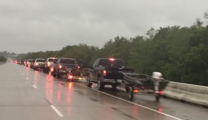 Massive Line of Trucks Towing Boats Forming in Houston Texas To Help Hurricane Victims