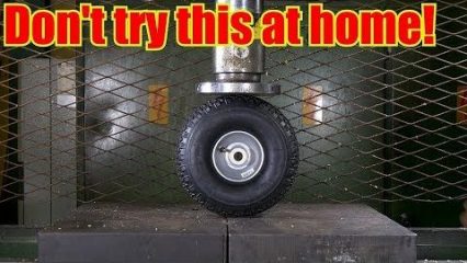 Crushing An Over Inflated Tire with a Hydraulic Press