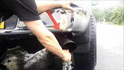 Shoving water inside an exhaust to clean it! Is this safe?