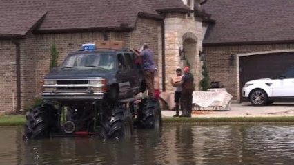 Men Use Monster Trucks to Help Navigate Flood Waters and Rescue Stranded Drivers!