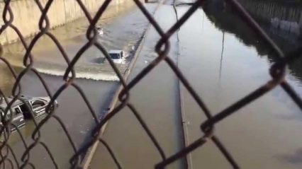 Toyota Prius Driver Barrels Through Flooded Freeway… Will He Make It?