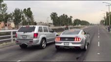 Jeep SRT8 On Nitrous vs Ford Mustang On The Street!