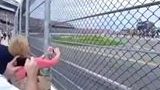 NASCAR Fly By is So Brutal It Nearly Makes This Lady Lose Her Balance