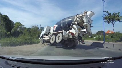 Heavy Cement Truck Goes Down While Trying To Avoid Slowing Traffic