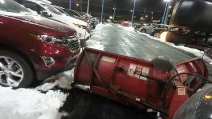 Plow Truck Almost Crashes Into 40 Brand New Cars