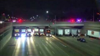 13 Big Rigs Line Up Under Freeway Overpass To Help Person Considering Suicide