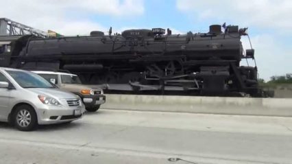 Imagine Seeing This Massive Train Rolling Down The Freeway…