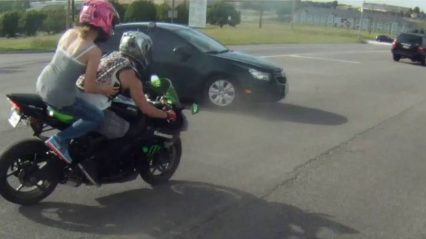 Biker Tries to Run Red Light With Passenger… Ends Up Crashing Into A Car!