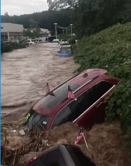Insane Floods Take Out Dealership, Cars Float Down The Street