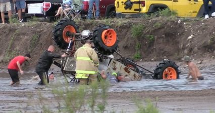 Mud Truck Flips Over in Water, Driver Gets Trapped Inside.