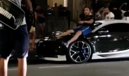 Pedestrian Lays Across The Hood of Stranger’s Bugatti To Take Picture, Doesn’t End Well