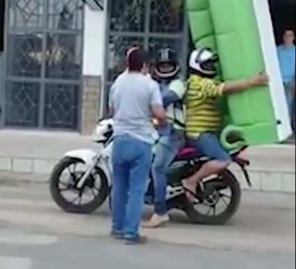 Determined Movers Use Motorcycle To Haul A Couch