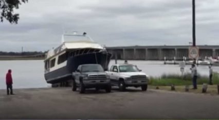 Two Cummins Powered Dodge Trucks Pull 60,000lb Ship Up A Ramp