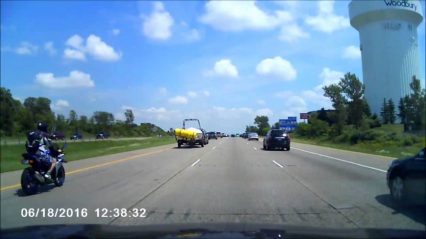 Rider Goes Airborne After Running Over Unsecured Load
