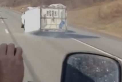 Driver Pulls U-Haul Trailer Down Highway On Its Side – HOW!?