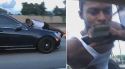 Girlfriend Speeds Down Highway in Mercedes as Boyfriend on the Hood Calls 9-1-1