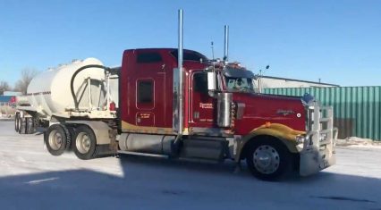 Semi Truck Driver Kicks Into High Gear, Snow Drifts With Trailer