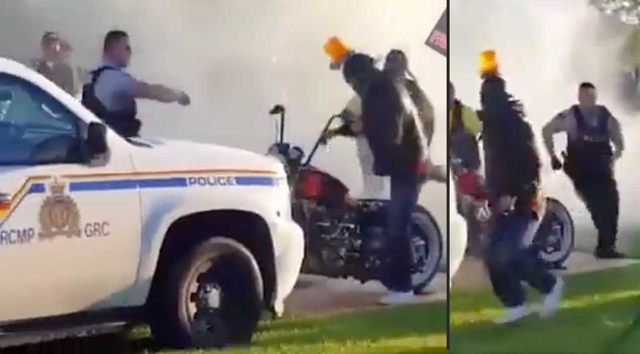 Biker Uses Cop Car To Do A Burnout