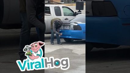 Dude Breaks Out Spray Paint, Touches up His Ride in the Parking Lot