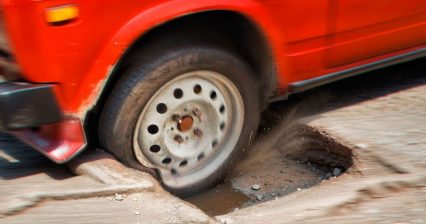 Why You Should NEVER Brake While Hitting a Pothole!